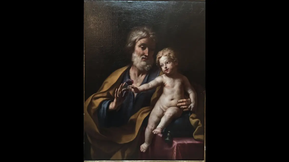 San Giuseppe tiene in braccio Gesù Bambino